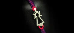 PULSERA VIRGEN NYLON MORADA/ROSA