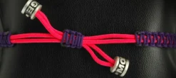PULSERA VIRGEN NYLON MORADA/ROSA